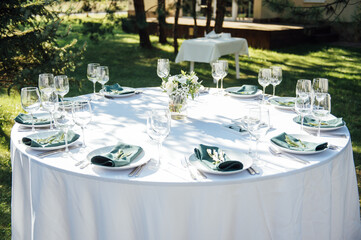 Preparing for an open-air party. Decorated served tables await guests. Decoration Details