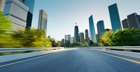 Highway overpass motion blur with cityscape skyline - obrazy, fototapety, plakaty
