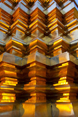 wall detail with golden corners of a temple interior