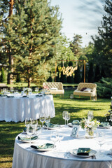 Preparing for an open-air party. Decorated served tables await guests. Decoration Details