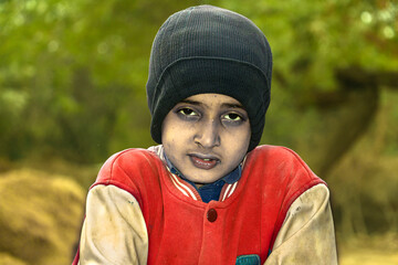 Asian child boy wearing a winter hat in winter