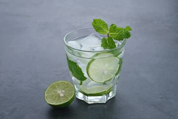 Detox water infused with lime and mint for health. Space for text. 
