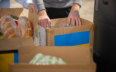Group of volunteers starting their work with donations for Ukrainian refugees all the necessary...