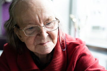 Portrait of a white grandmother wearing eyegasses, smiling