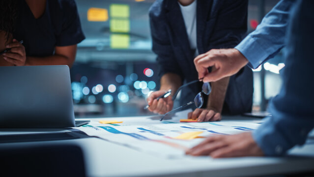 Office Conference Room Meeting: Diverse Team of Top Managers Talk, Brainstorm, Use Digital Tablet. Business Partners Discuss Financial Reports, Plan Investment Strategy. Team of Three