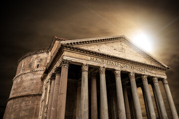 Pantheon of Rome against a dark dramatic sky with sunbeams, Italy Europe. Ancient Roman temple...