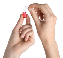 Woman opening glass ampoule with pharmaceutical product on white background, closeup