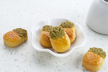 Nastar Cookies, Taiwanese Pineapple Cookies with pineapple-shaped filled with jam. Served on plate.