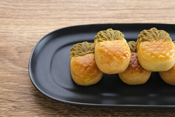 Nastar Cookies, Taiwanese Pineapple Cookies with pineapple-shaped filled with jam. Served on plate.