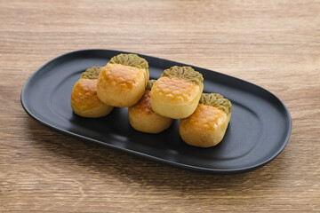 Nastar Cookies, Taiwanese Pineapple Cookies with pineapple-shaped filled with jam. Served on plate.