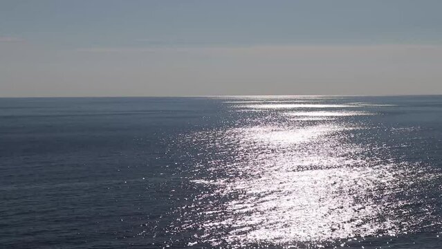 View of the calm sea during the day in Italy near the city of Scalea. Aerial view of the sea. Turquoise water background from front view. Summer seascape. Travel video.