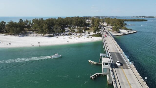 beautiful orbiting aerial of Longboat Pass looking north to Coquina Beach, from Longboat Pass Bridge in Sarasota, Florida