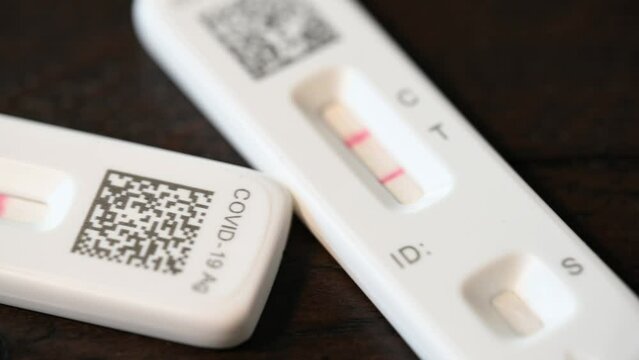 2 positive Covid-19 home test kit results, slow macro slider