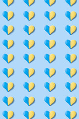 Pattern with heart shape of yellow-blue colors of the Ukrainian flag. Vertical format