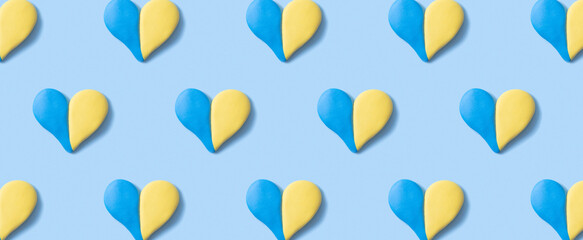 Pattern with heart shape of yellow-blue colors of the Ukrainian flag. Banner format