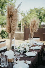 Wedding. Birthday. Reception. Decoration, chairs, tables and flowers.