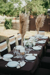 Wedding. Birthday. Reception. Decoration, chairs, tables and flowers.