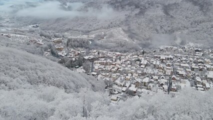 Krasnaya Polyana village, surrounded by mountains covered with snow