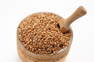 Pearl barley groats in bowls and bags isolated on a white background. High quality photo
