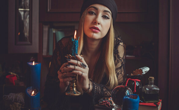 Shaman woman doing ritual magic for helping. Concept of pagan or wicca magic. Old and new world