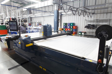 Industrial garment factory, a special Laser Cutting Fabric cuts out certain textile pieces.