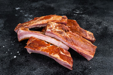 Sliced Smoked BBQ Pork Ribs. Black background. Top view