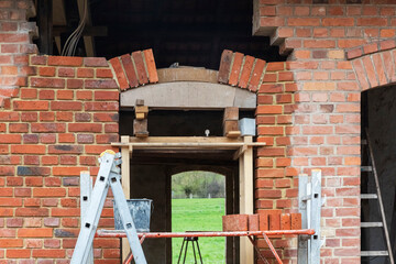 Building a Segmental Arch with Old Bricks - obrazy, fototapety, plakaty