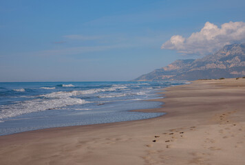 Patara beach is famous tourist landmark and natural destination in Turkey. Majestic view of orange sand dunes and hills glows