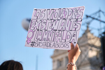 Woman holds a sign with a text against the abuse of women, in Argentina