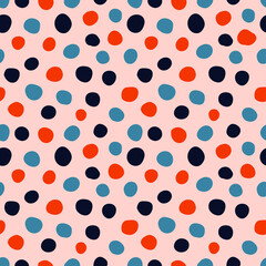Colorful spots seamless pattern with pink background.
