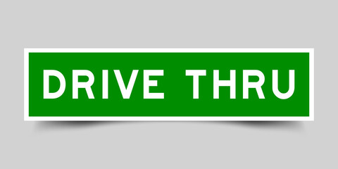 Sticker label with word drive thru in green color on gray background