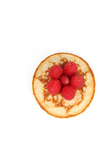 Pancakes with red fruits: blueberries, raspberries and blackberries on a white background 