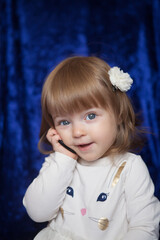 Little girl portrait at home. One-year-girl playing on floor