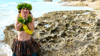 Surprised woman covering her face. Hawaiian woman enjoys hula dancing on the beach barefoot wearing...