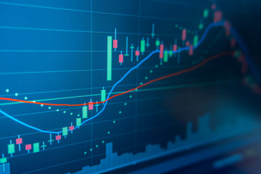 Blue Stock Exchange Market trading graph on screen laptop for  financial investment. Stock analysis chart display.Finance and Economic concept