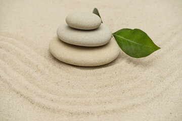 Fototapeta na wymiar Sand garden meditation stones. Stones and lines. Concept of zen, balance, harmony.