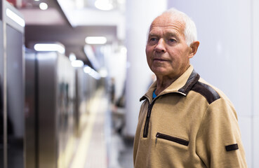 Old man in subway station