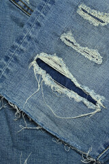 torn on denim jean textile