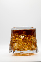 whiskey in a glass on a white background