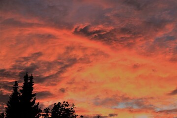 a red cloudy sky after sunset