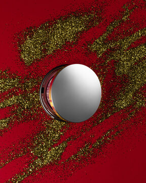 Face Highlighter Compact Makeup Powder  Case With Mirror. Cosmetic Product Advertisement On Red Decorative Background
