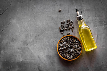 Sunflower oil in bottle with seeds. Cooking oil background