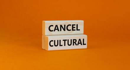 Cancel cultural symbol. Concept words Cancel cultural on wooden blocks on a beautiful orange table...