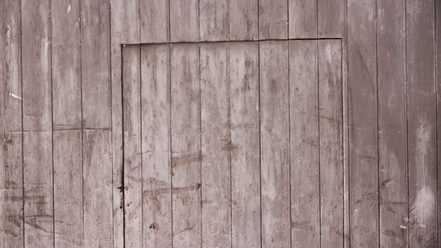 Puerta de garage r&uacute;stica de madera desgastada por el tiempo