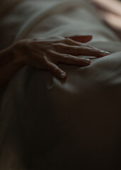 Close-up of a woman's hand. Gentle and sensual movement. Female attractiveness and temptation. Soft...