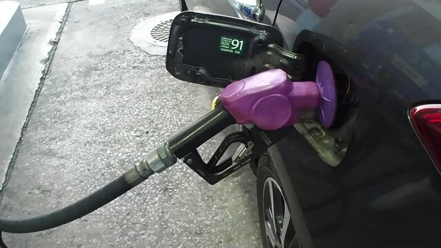 Footage Full HD 1080P. Refueling, in the gas tank of a car at a gas station (no people), petrol prices and fuel crisis concept.