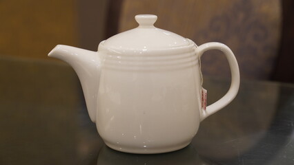 White porcelain teapot on the table