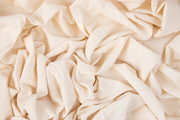 Light fabric texture. Background with folds. Close-up.