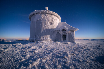 St. Lawrence Chapel on the top of Śnieżka in the Karkonosze Mountains. Winter view of the...