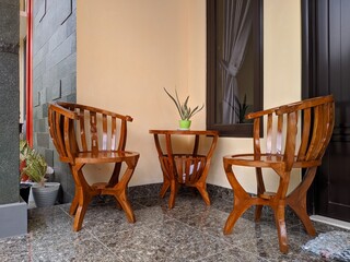 Wooden table and chairs on the terrace of the house